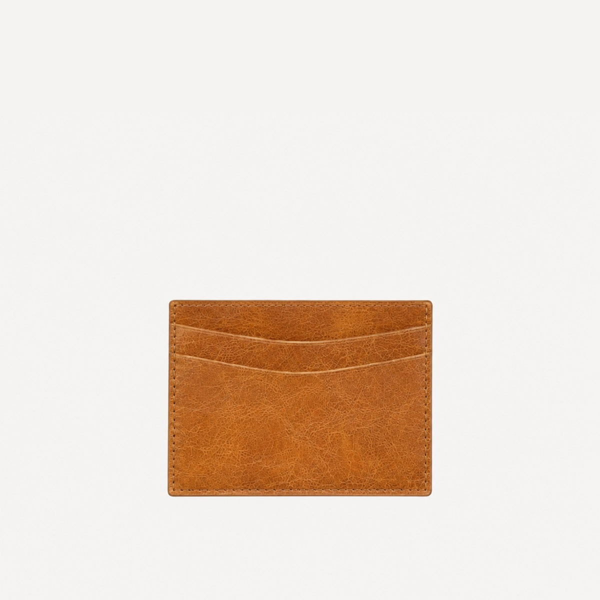 PaulyJen distressed cognac Italian leather card holder with a slim rectangular design